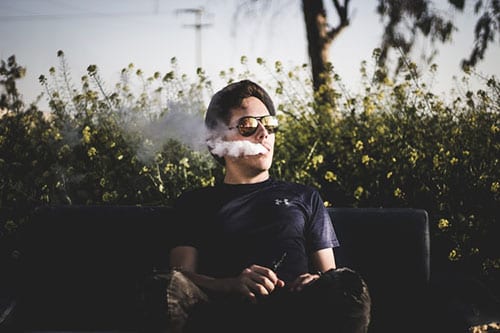 Vaping on a bench