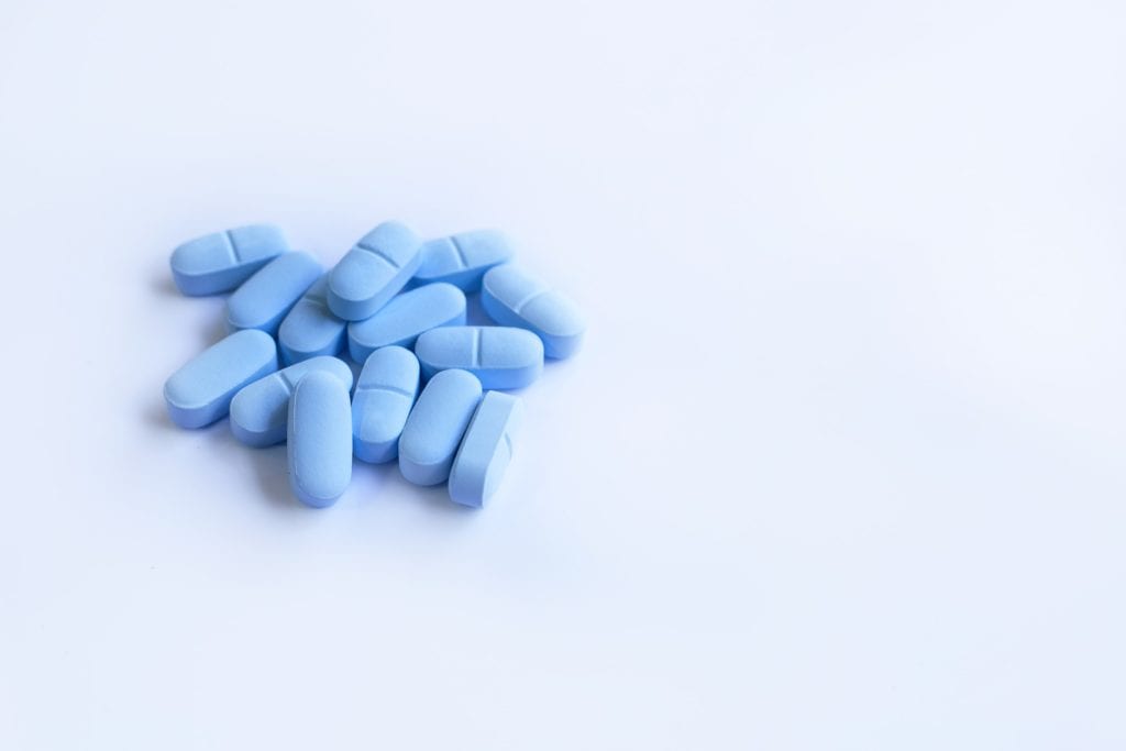 14 Truvada for PrEP blue pills with a white background. 