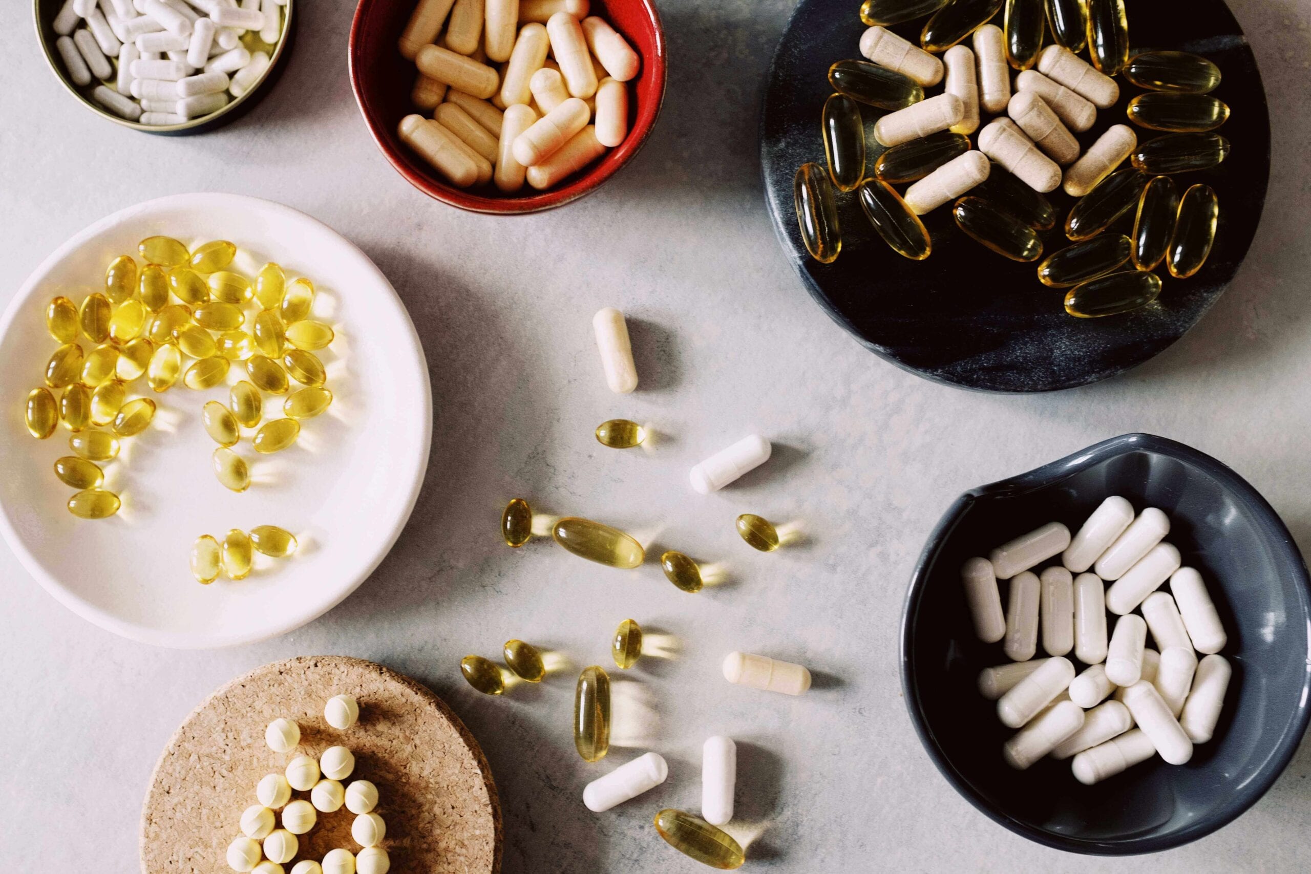 Variety of NAD+ supplements on a table used for anti-aging.
