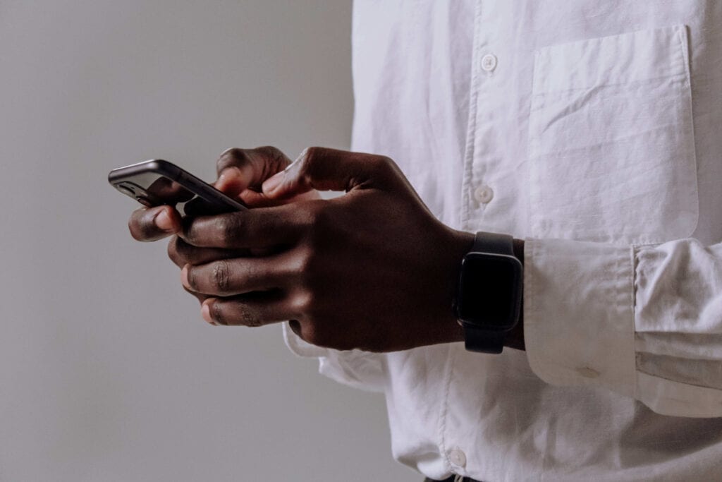 Man using phone for online therapy